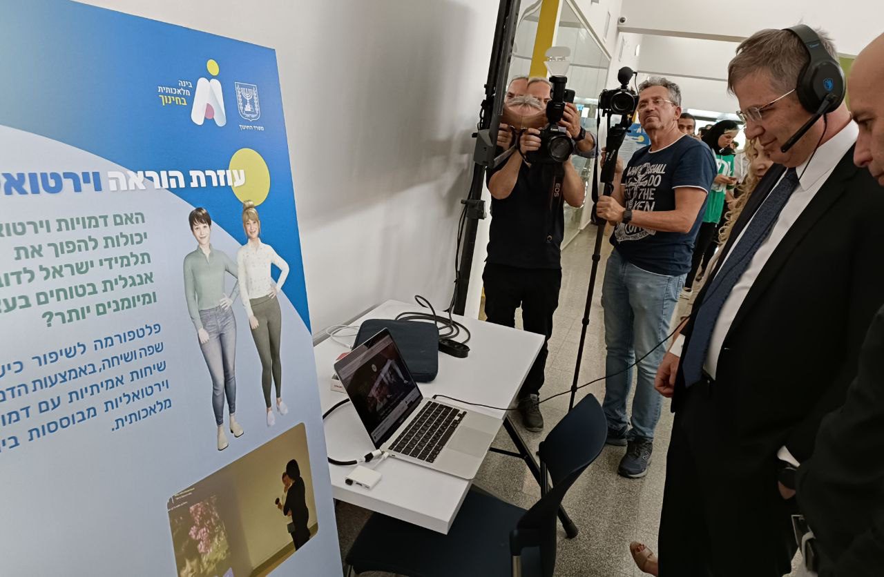 Israeli Minister of Education Yoav Kisch, and Ministry CEO Asaf Zalel, visit Beyond Virtual's stand at the AI in education conference in June 2023
